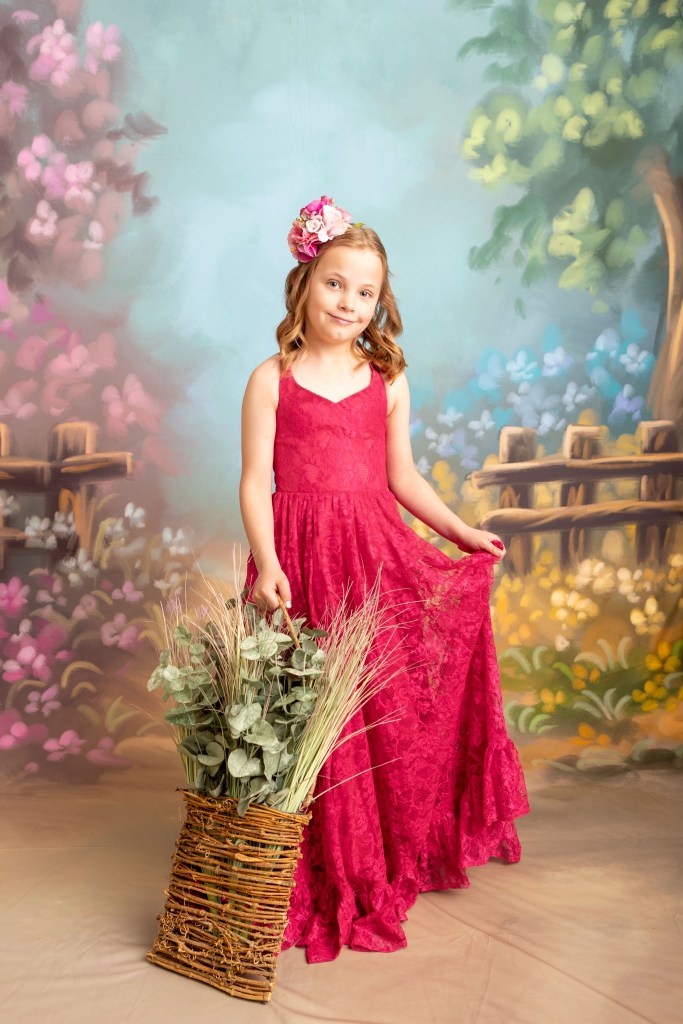 young girl studio portrait on painterly background
